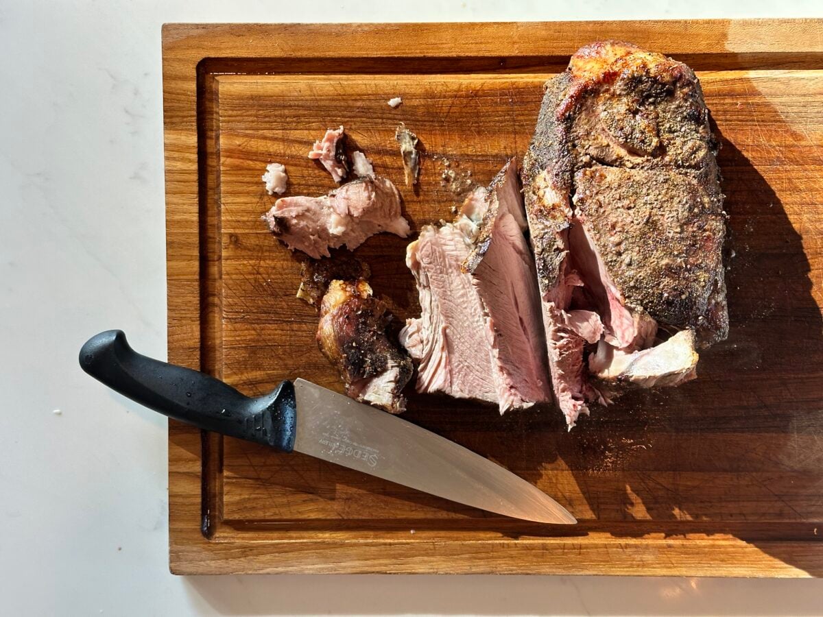 Carving pork roast on board